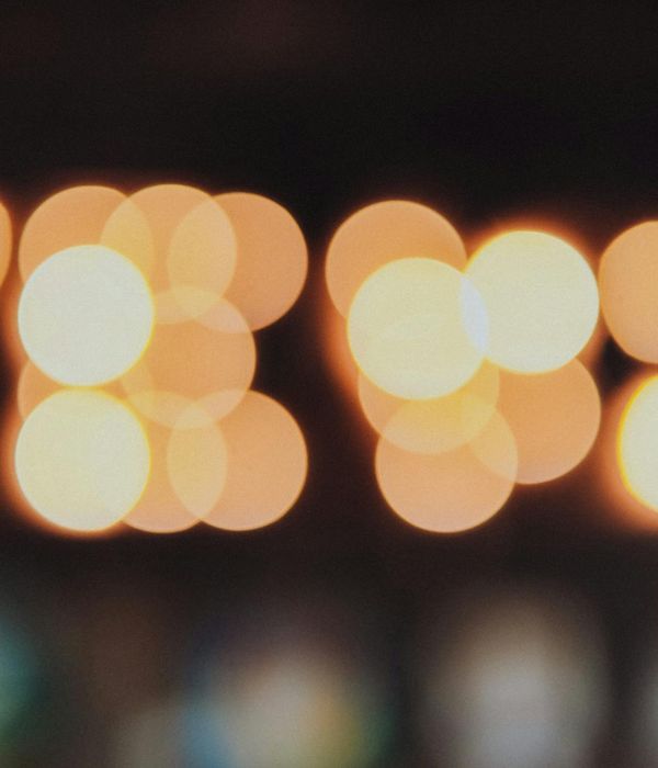 Abstract dark yoga atmosphere with amber light glows